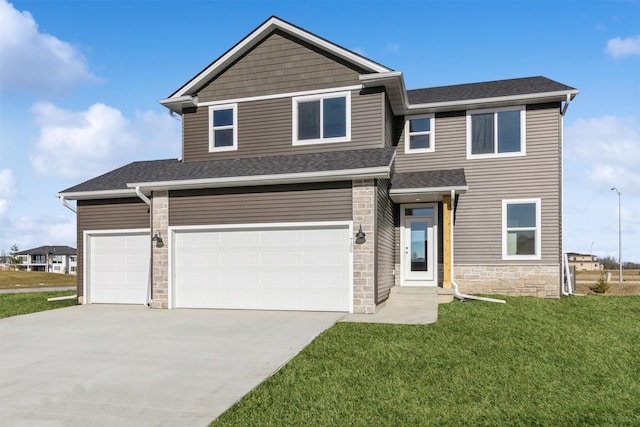 view of front of house with a garage and a front lawn