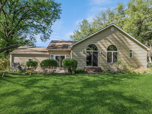 back of house with a yard