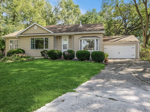 ranch-style house with a garage and a front yard