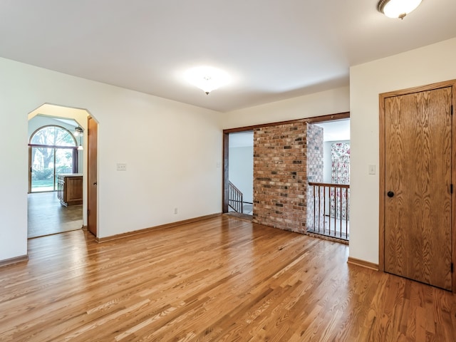 spare room featuring light wood-type flooring