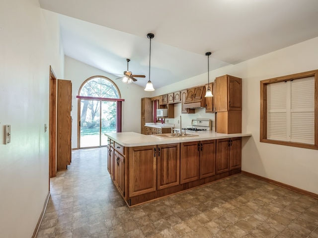 kitchen with vaulted ceiling, white appliances, kitchen peninsula, ceiling fan, and sink