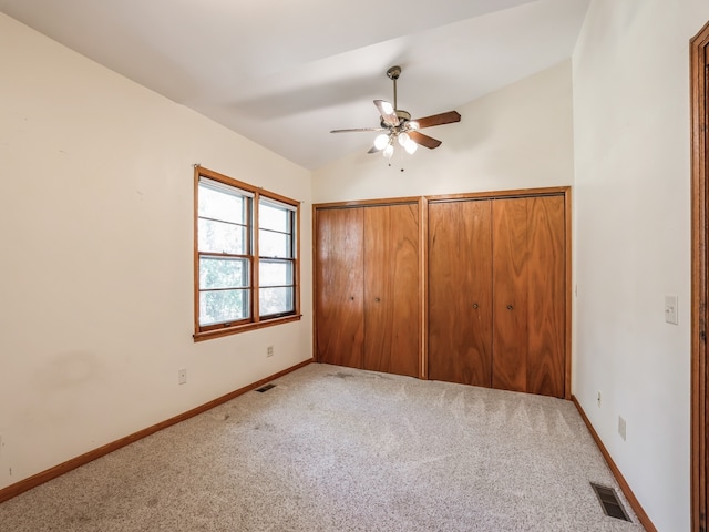 unfurnished bedroom featuring ceiling fan and carpet