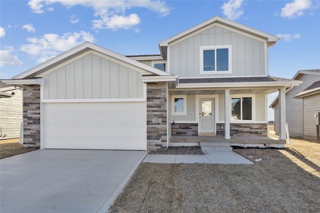 view of front of property featuring a porch and a garage