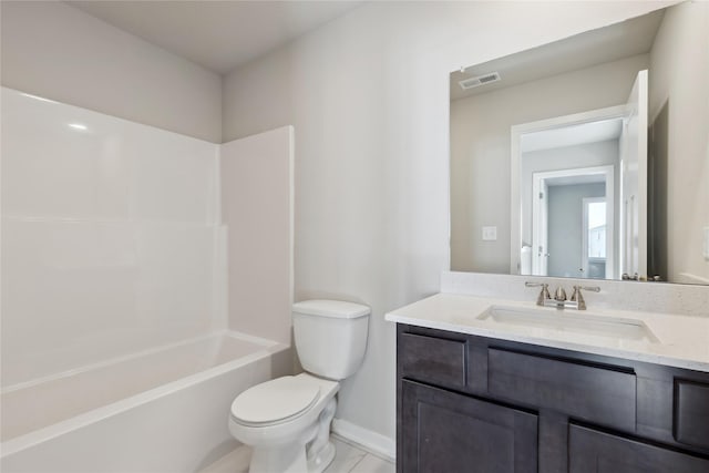 full bathroom featuring toilet, vanity, and tub / shower combination