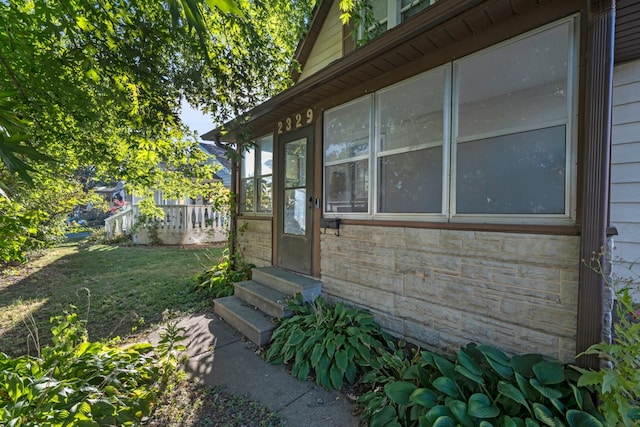 view of property exterior with a yard