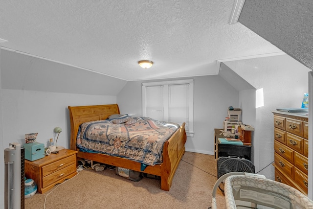 carpeted bedroom featuring a textured ceiling and lofted ceiling