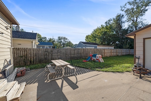 view of patio / terrace with an outdoor fire pit