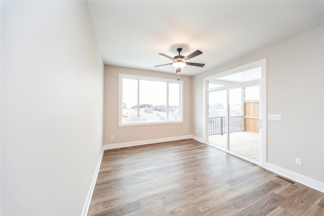 unfurnished room featuring ceiling fan and light hardwood / wood-style flooring