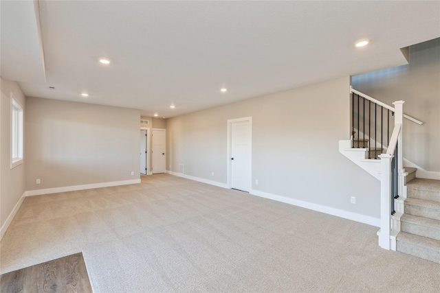 interior space featuring light carpet