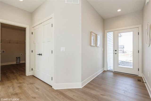 foyer entrance with light hardwood / wood-style flooring