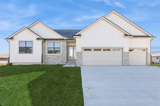 view of front of home with a garage and a front lawn