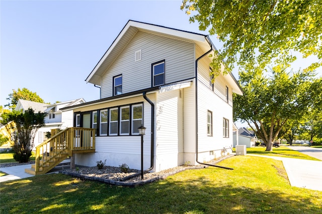 view of property exterior featuring central AC and a yard