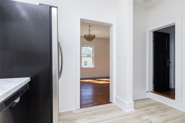 kitchen with light wood-type flooring and stainless steel appliances