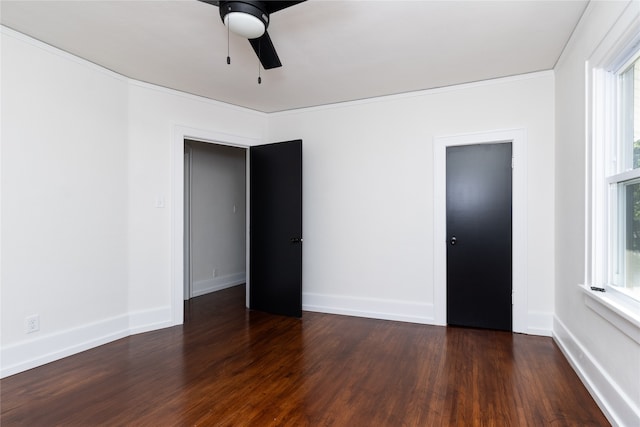 unfurnished room featuring ceiling fan, crown molding, and dark hardwood / wood-style flooring