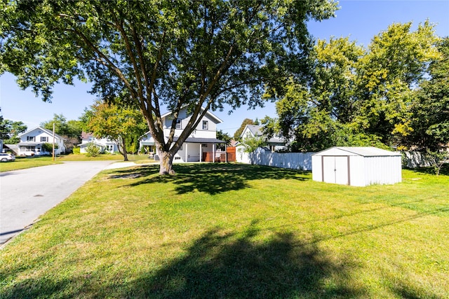 view of yard featuring a storage unit