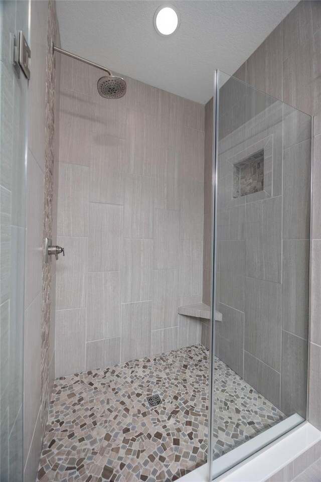 full bathroom featuring a shower stall