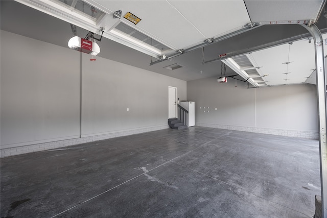 garage featuring a garage door opener