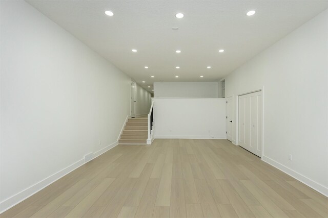 basement featuring light wood-type flooring