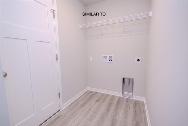 washroom featuring hookup for a washing machine, light hardwood / wood-style flooring, and electric dryer hookup