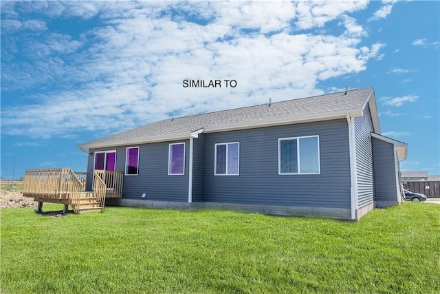 rear view of property featuring a yard and a wooden deck