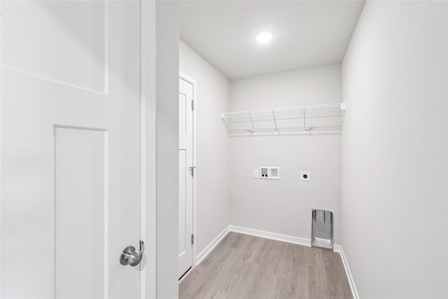4428 NE 8th St, Ankeny, IA 50021 - laundry area featuring electric dryer hookup, washer hookup, light wood-type flooring, and baseboards