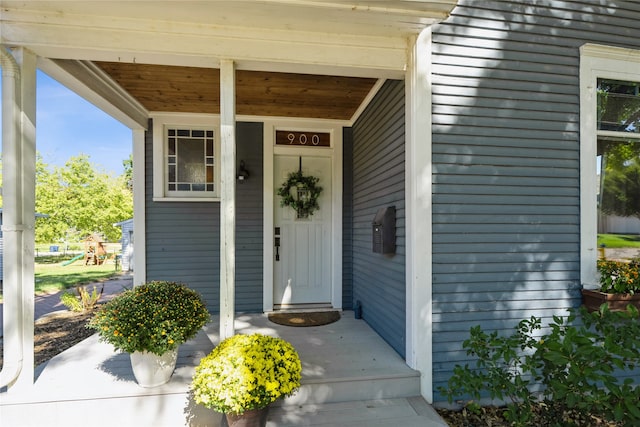 property entrance featuring covered porch