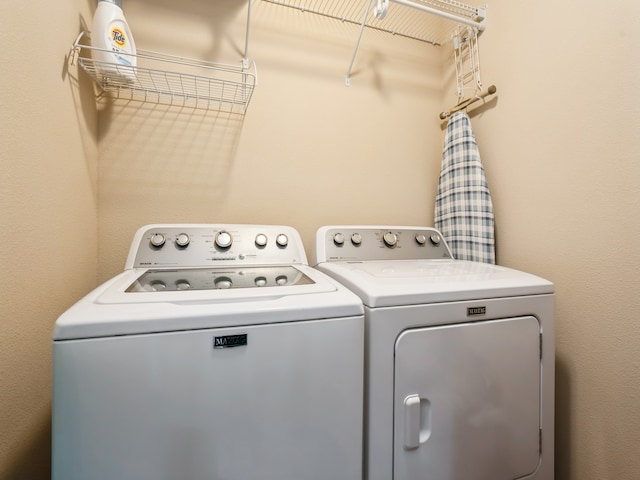 washroom with washer and dryer