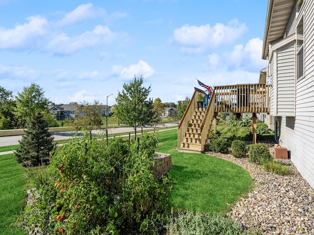 view of yard featuring a wooden deck