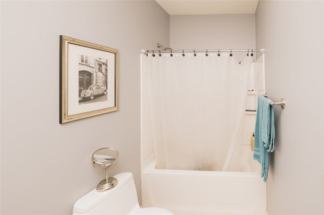 bathroom with shower / tub combo and toilet