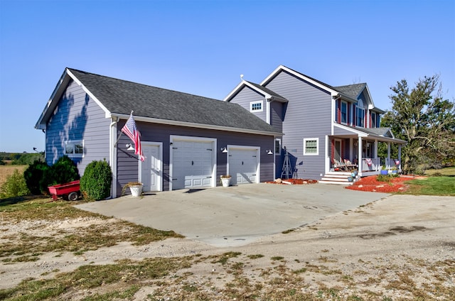 view of front of home featuring a garage and covered porch