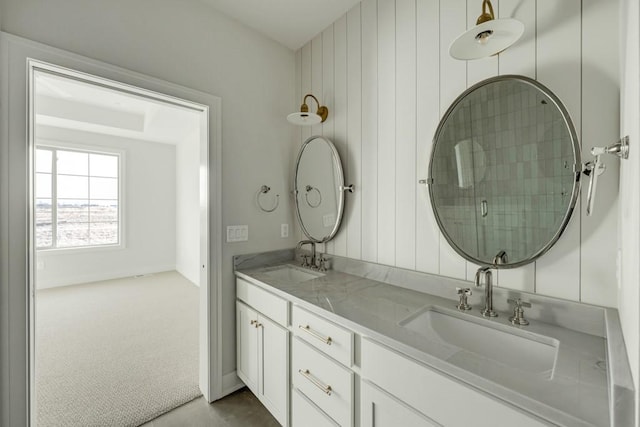 bathroom with walk in shower and vanity