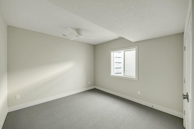 empty room with ceiling fan and carpet