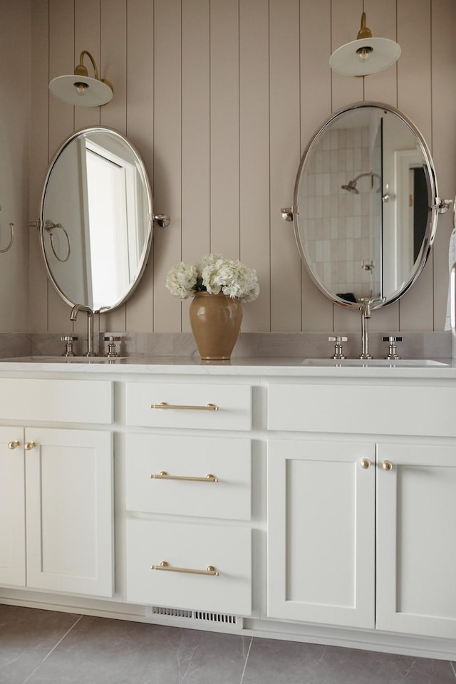 full bathroom with tile patterned flooring and vanity