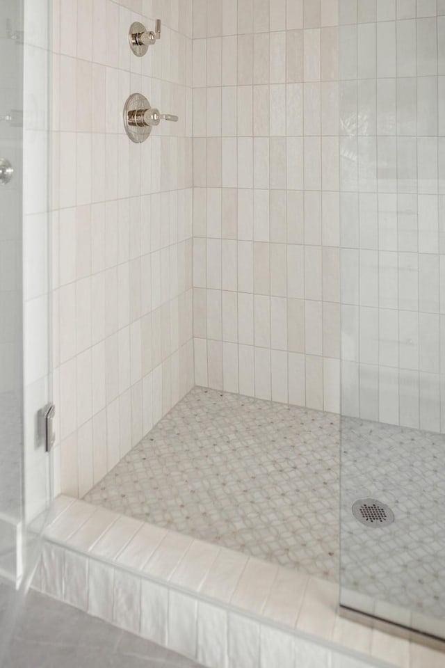 full bathroom with a tile shower