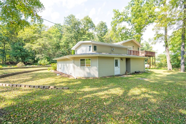 rear view of house with a lawn