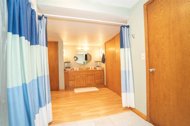 corridor featuring light hardwood / wood-style floors