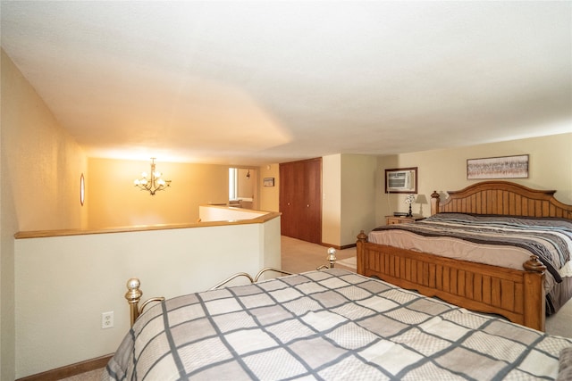 carpeted bedroom featuring a notable chandelier