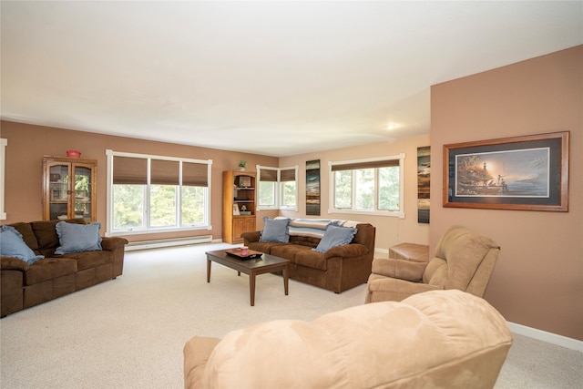 living room featuring light colored carpet and a baseboard heating unit