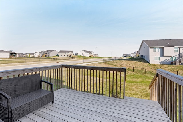 wooden deck with a lawn