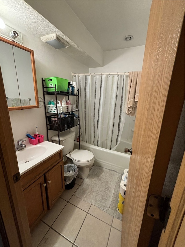 full bathroom with vanity, tile patterned floors, toilet, and shower / tub combo with curtain