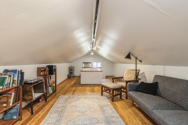 interior space with lofted ceiling and light hardwood / wood-style floors