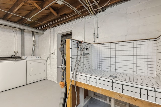 basement with washer and clothes dryer