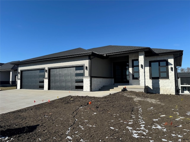 prairie-style house featuring a garage