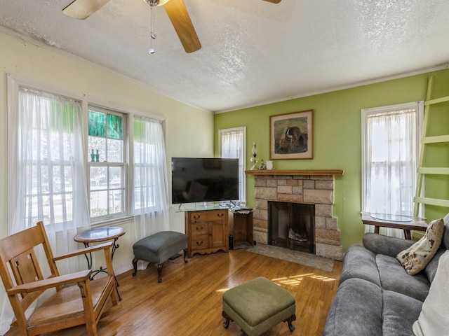 living room featuring light wood-type flooring and a textured ceiling