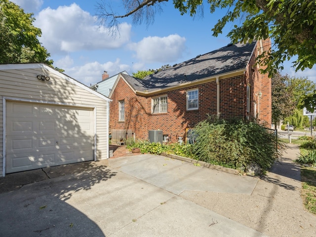 view of front of house featuring central AC and a garage