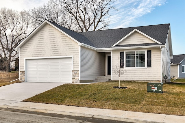 view of front of house with a garage and a front yard