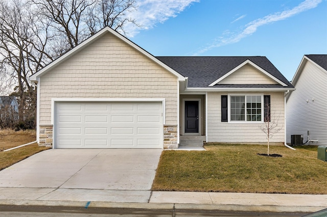 ranch-style home with cooling unit, a front yard, and a garage