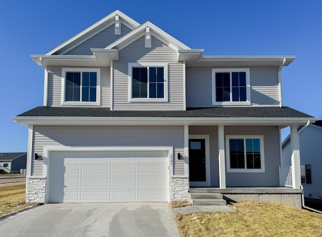 view of front of house featuring covered porch and a garage