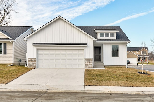 view of front of home featuring a garage and a front lawn