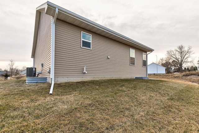 view of property exterior featuring a lawn